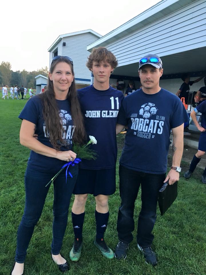 Family standing on field